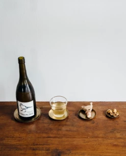 Only On The Avenue Live Brass Bottle Coaster